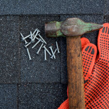 Hammer and nails on roof